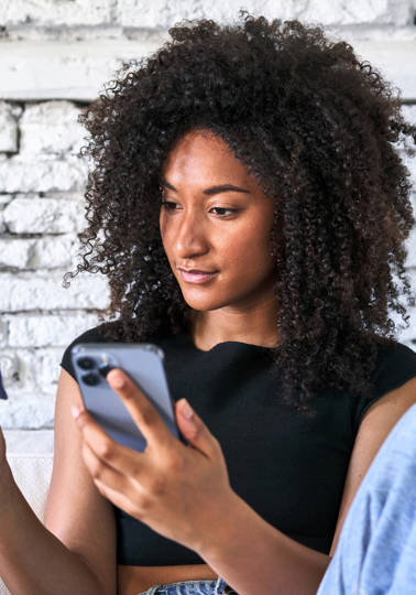 50 years of empowered consumers Women using a credit card online