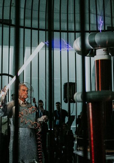 Bringing EU’s Contest for Young Scientists to life Old man holding a stick, part of large scientific experiment