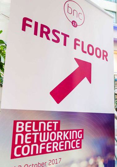 Surfing whilst networking Two men walking up stairs to building