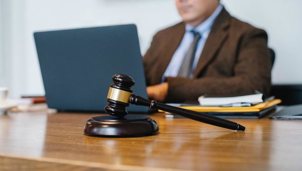 Click through to justice in the EU Judge Working On Laptop In Office
