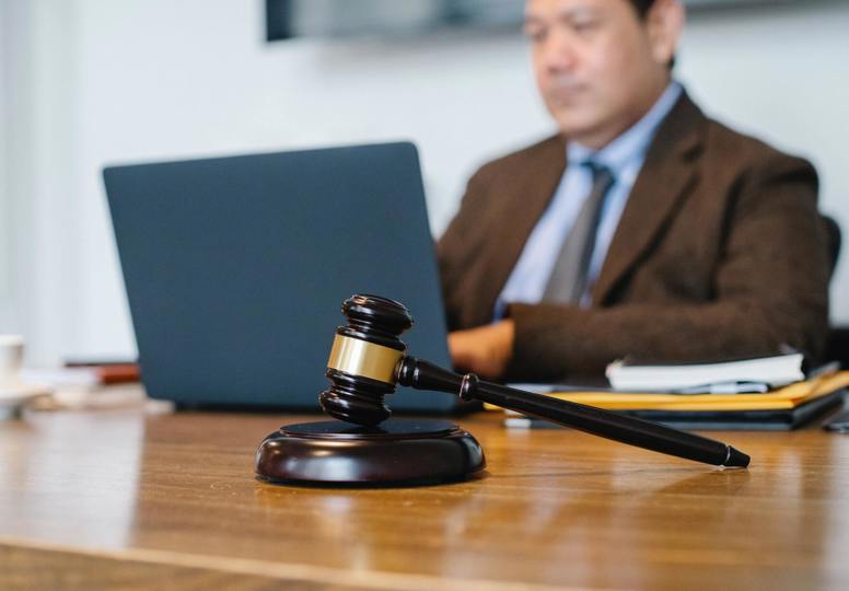 Click through to justice in the EU Judge Working On Laptop In Office