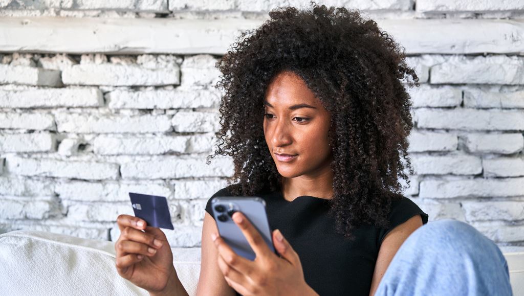 Women using a credit card online 