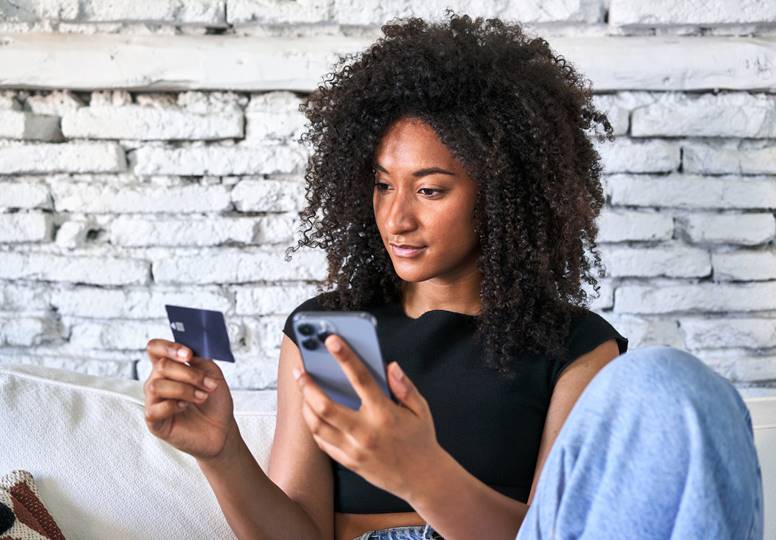 Women using a credit card online 