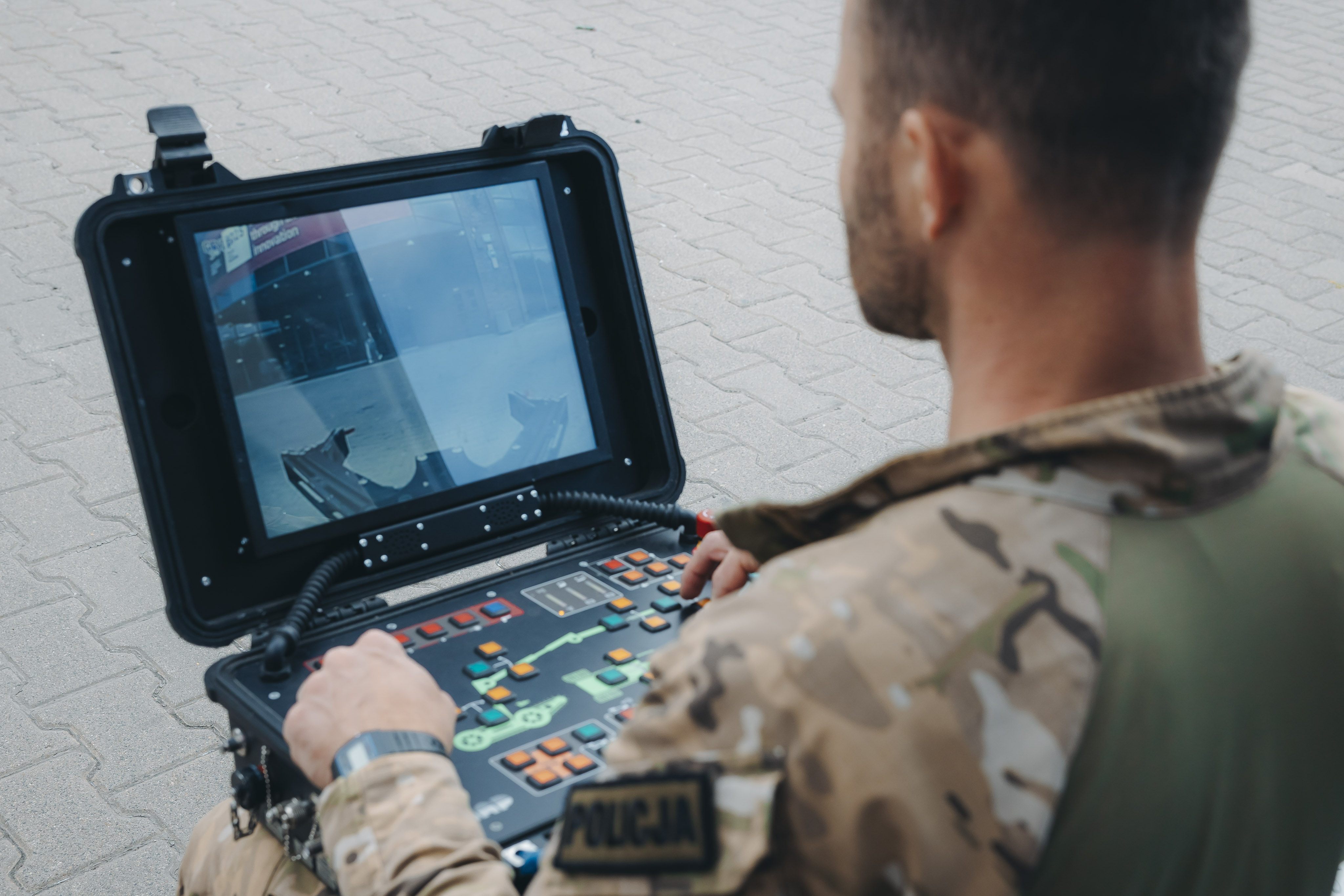 Man in front of screen during a demonstration of equipment at the Security research Event