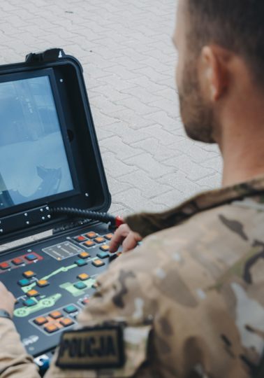 Man in front of screen during a demonstration of equipment at the Security research Event