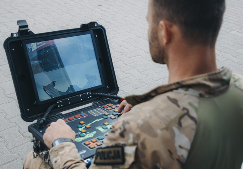 Man in front of screen during a demonstration of equipment at the Security research Event