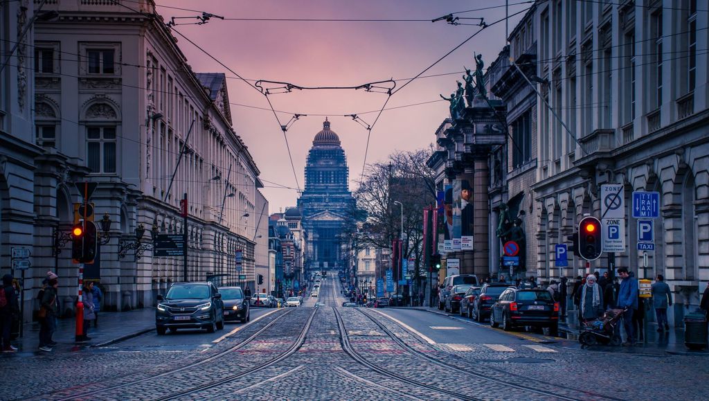 Taking the stress out of parking a street with red lights and parked cars on the moonlight