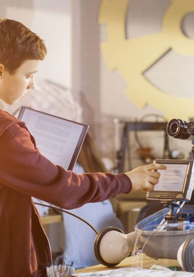 Live-in robot story goes viral Boy touching the screen of a robot