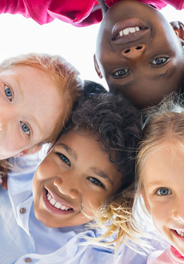 Debating children’s rights online View of happy children smiling in front of a camera