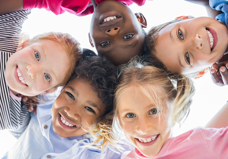 Debating children’s rights online View of happy children smiling in front of a camera