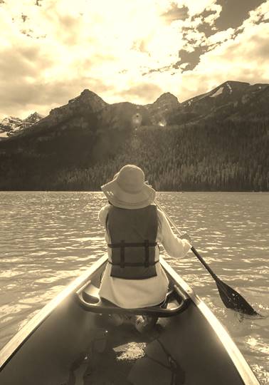 Woman canoeing on Lak Louise, Canada.
