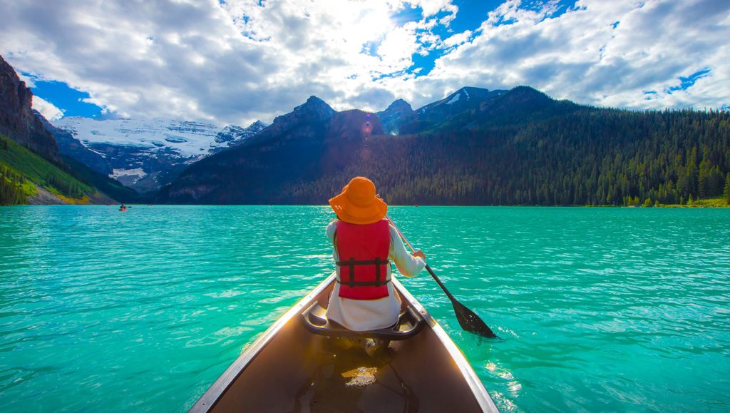 A lifeline on the trip of a lifetime Woman canoeing on Lak Louise, Canada.