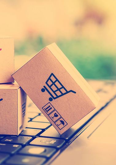 Consumer disputes settled online Three small cardboard boxes on an oversized keyboard