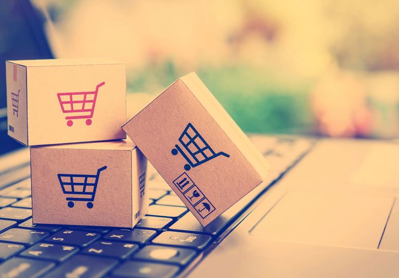 Consumer disputes settled online Three small cardboard boxes on an oversized keyboard