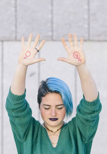 The gender pay gap exposed Women holding her arms up