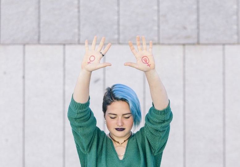 The gender pay gap exposed Women holding her arms up